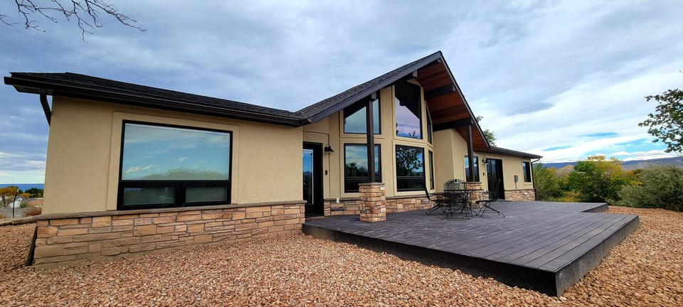 Large deck with patio table and chairs. Excellent mountain and sunrise views!