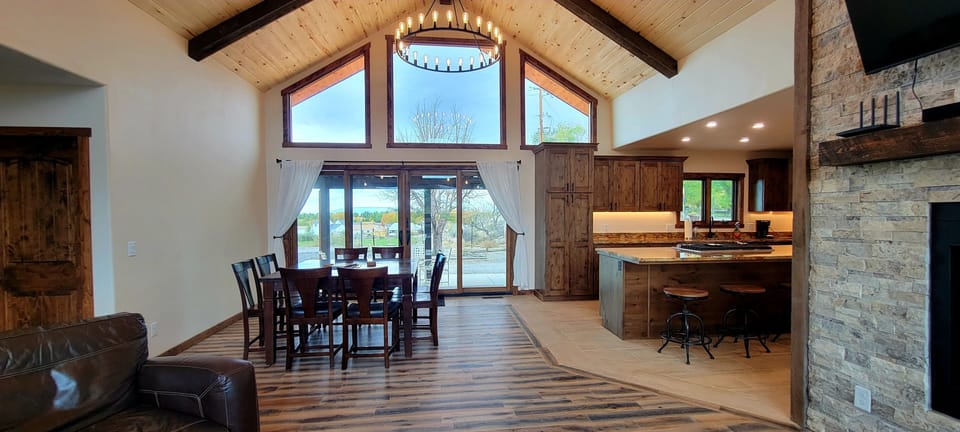 Table for 8 right off the kitchen. Large glass patio doors for sunset views.