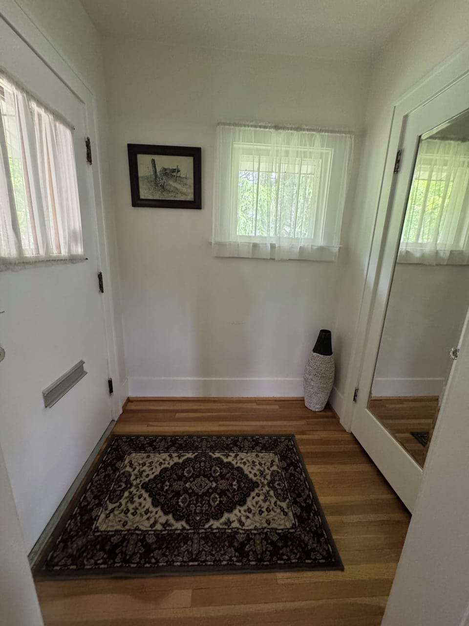 Front door and large coat closet with games.