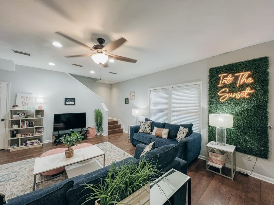 Open concept main floor living, dining room, and kitchen.