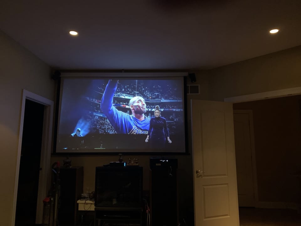 Theatre room features a large 96 inch screen for your enjoyment 