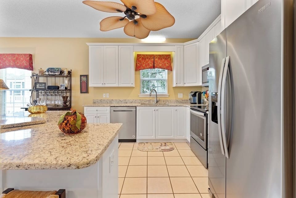 Fully stocked large kitchen with modern appliances. 