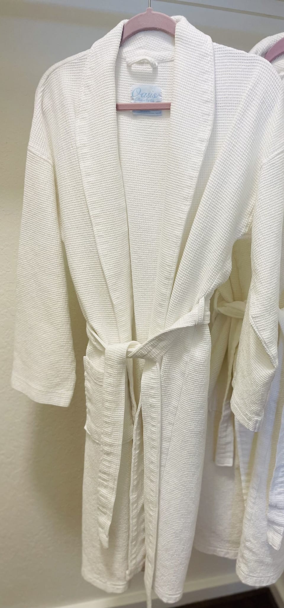 Snuggle into your comfy white robe after a refreshing shower.