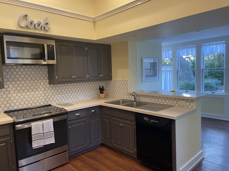 Well-stocked Gourmet Kitchen with stainless appliances, paper products, etc.