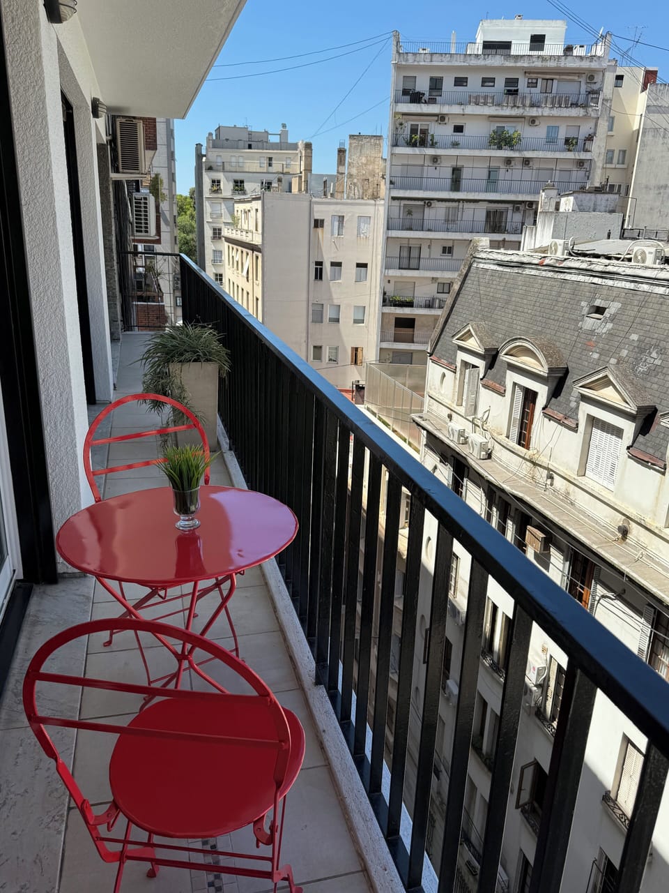 Balcony on a quiet, cobble street.