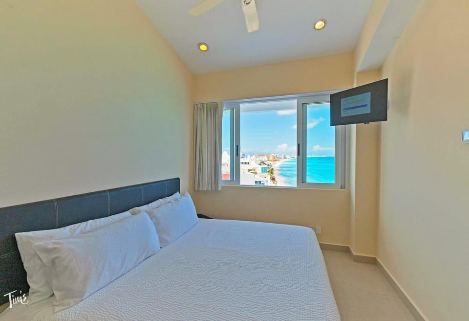 Penthouse 1 of 4:  Bedroom 3 has an Ocean and Beach View and a King Bed