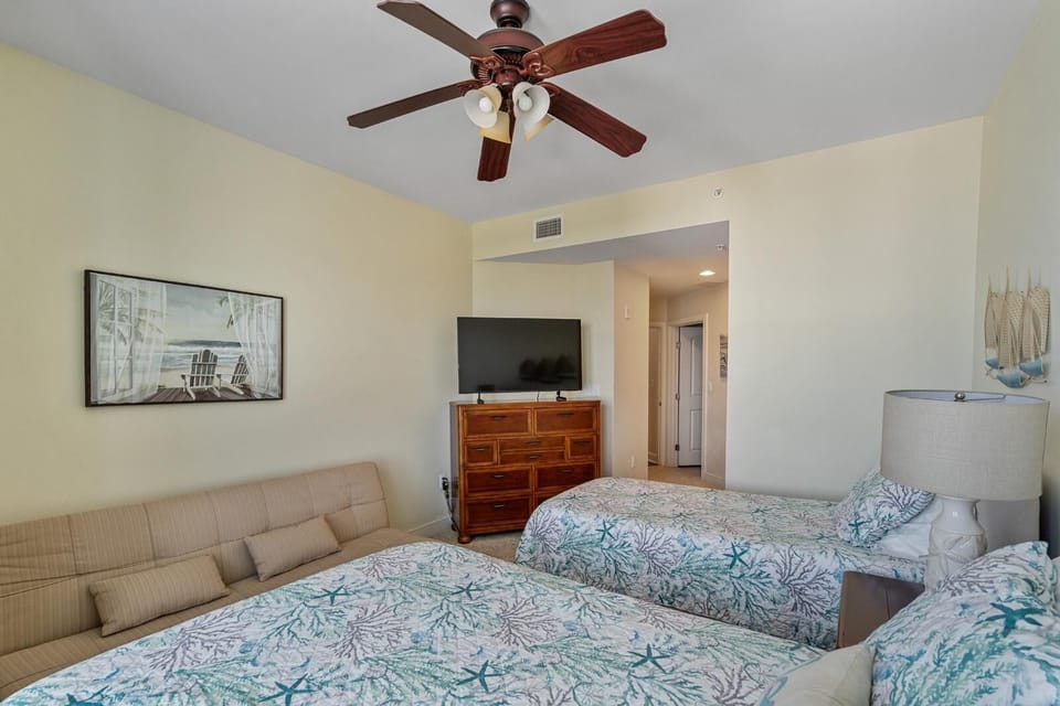 Spacious bedroom with cozy beds and relaxing seating area