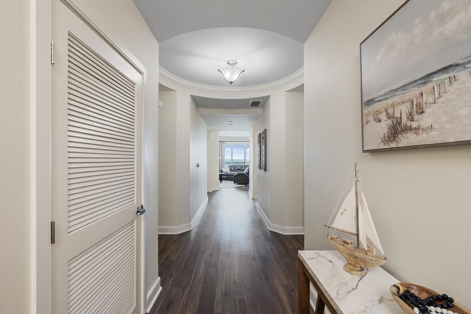 Welcoming hallway with charming coastal decor and warm lighting