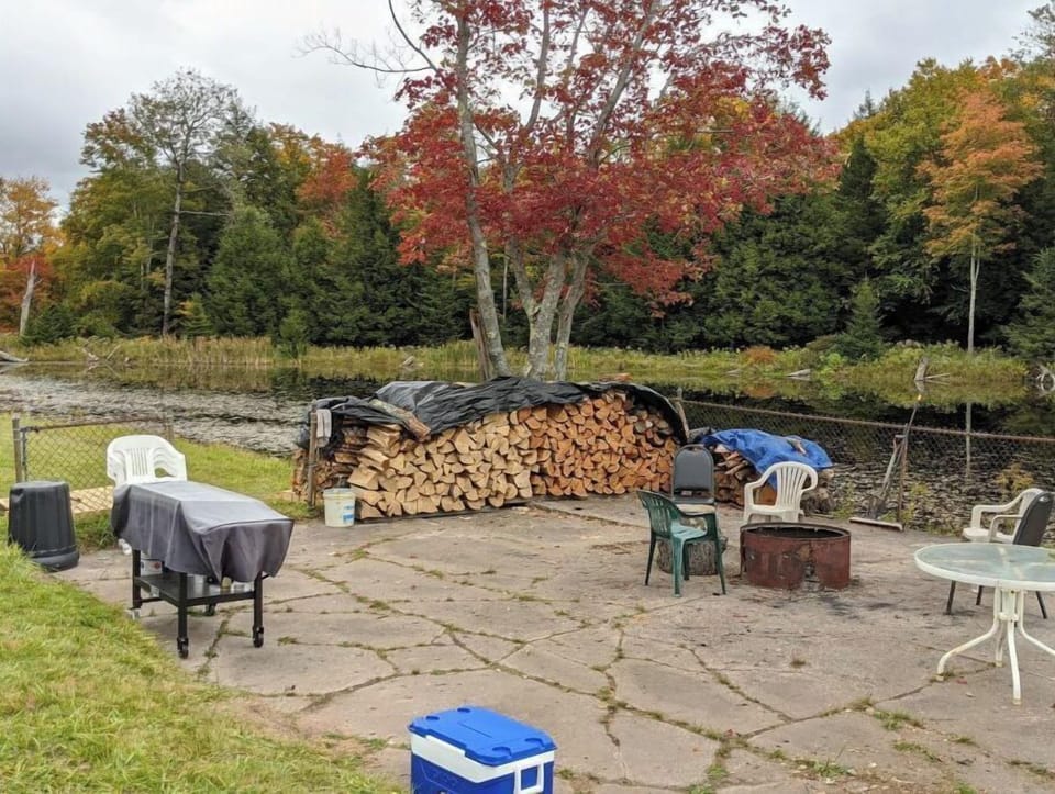 Hangout Patio complete with propane grill, firepit and picnic tables. 
