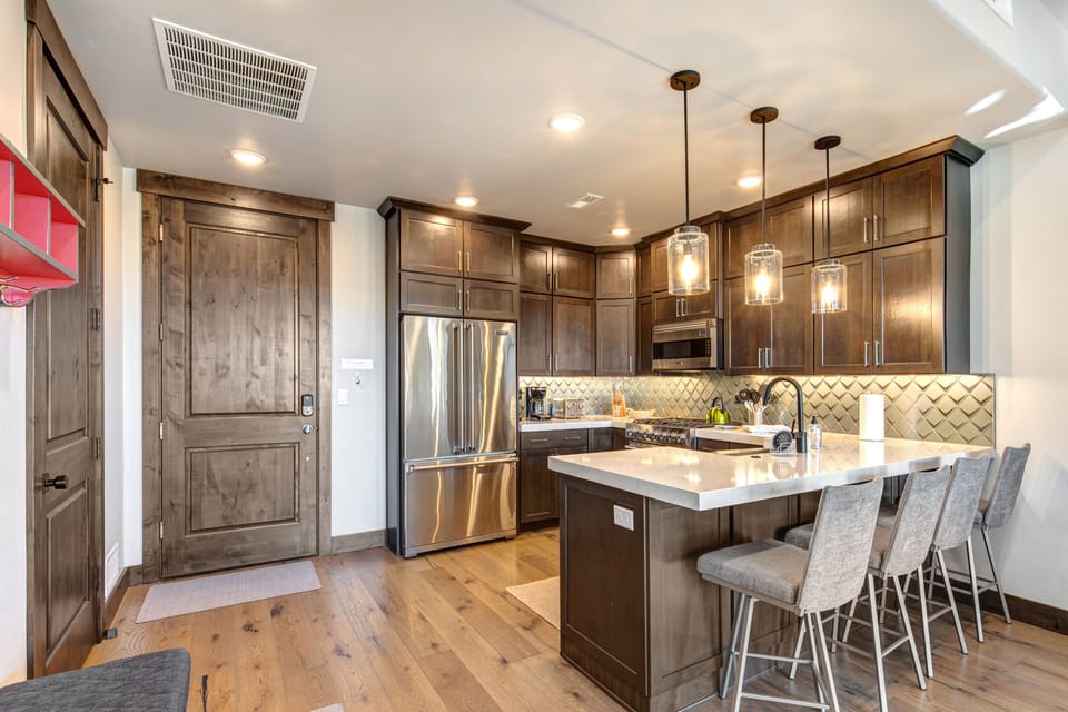 Condo Entry and Fully Equipped Kitchen with bar seating for four