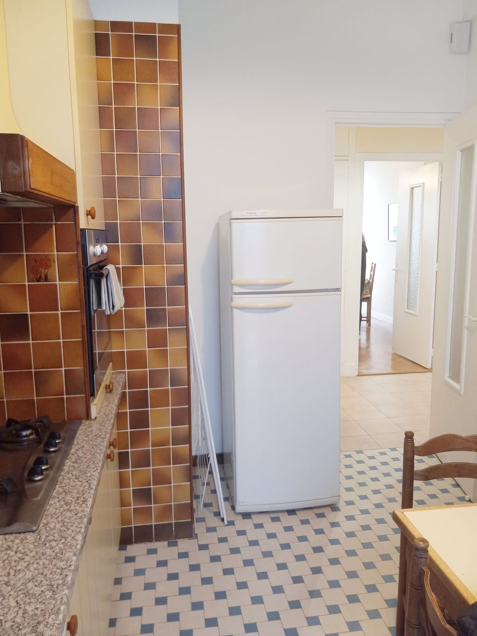 View through kitchen door to the other rooms. 