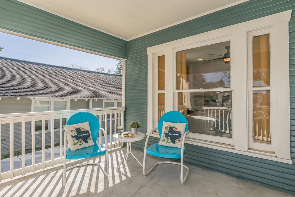 Spacious front porch that invites guests to enjoy a morning cup of Joe.