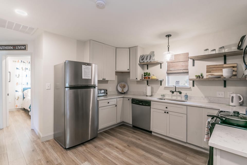 Large kitchen with 2 bedrooms at the back of the house.