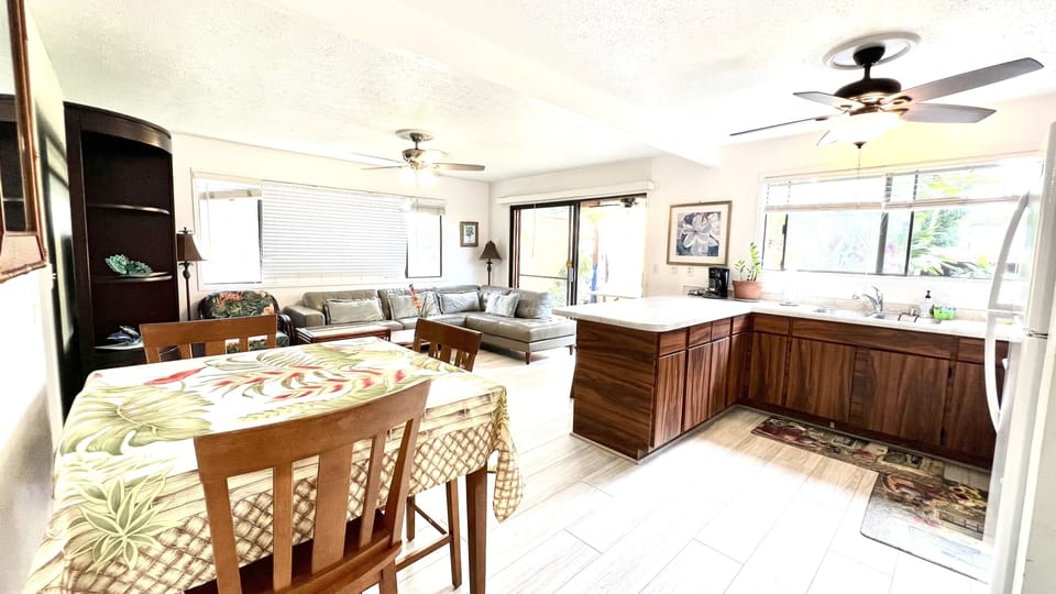 Dinning table with 3 chairs and two bar chairs to seat comfortably 5 people