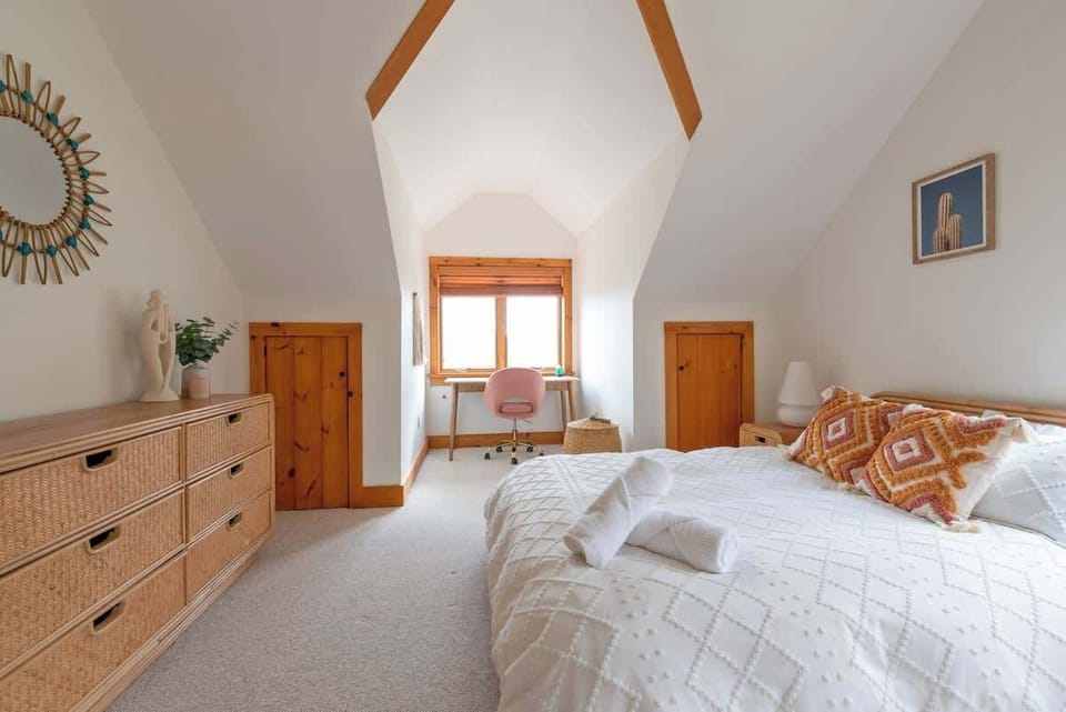 The bedrooms each have a warm and cozy boho feel with unique touches