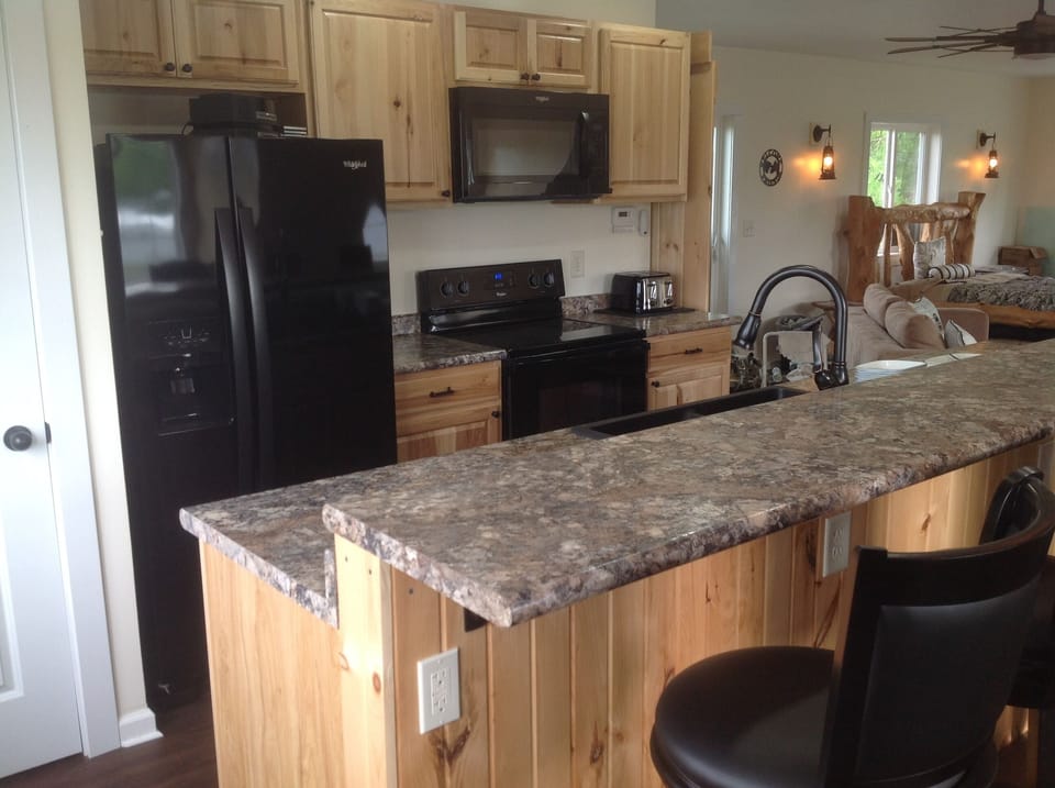 Kitchen is fully furnished with coffee maker, blender, mixer, toaster, dishes.