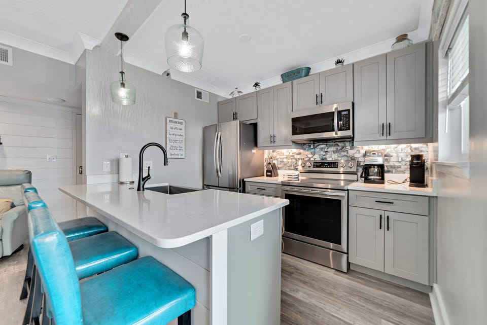 Kitchen with all Samsung stainless steel appliances and quartz countertops