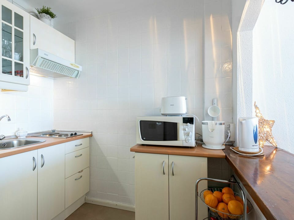 Cabinetry, Countertop, Kitchen Appliance, Kitchen Stove, Kitchen, Wood, Home Appliance, Cooktop, Lighting, Gas Stove