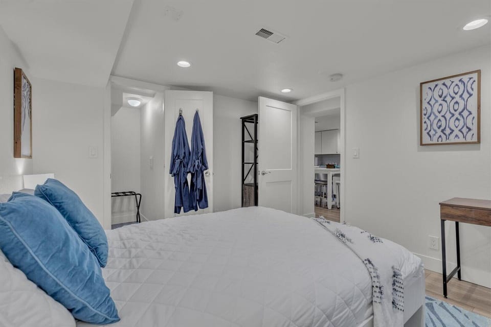 Bright modern bedroom with cozy bedding and calming blue accents