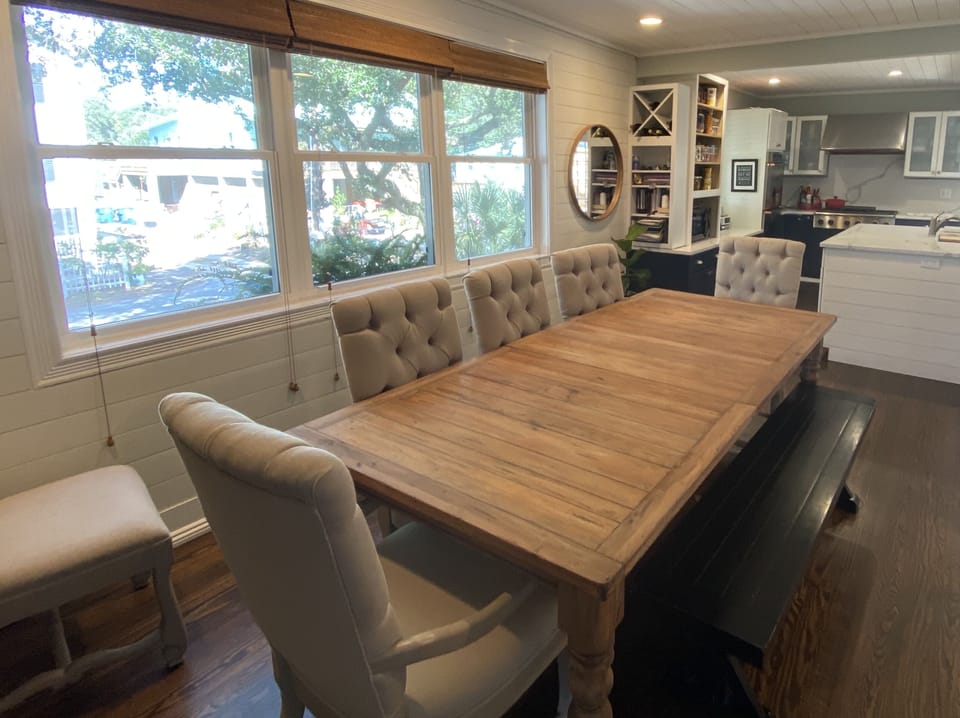 Large dining table inside the front door seats 10-12 people.