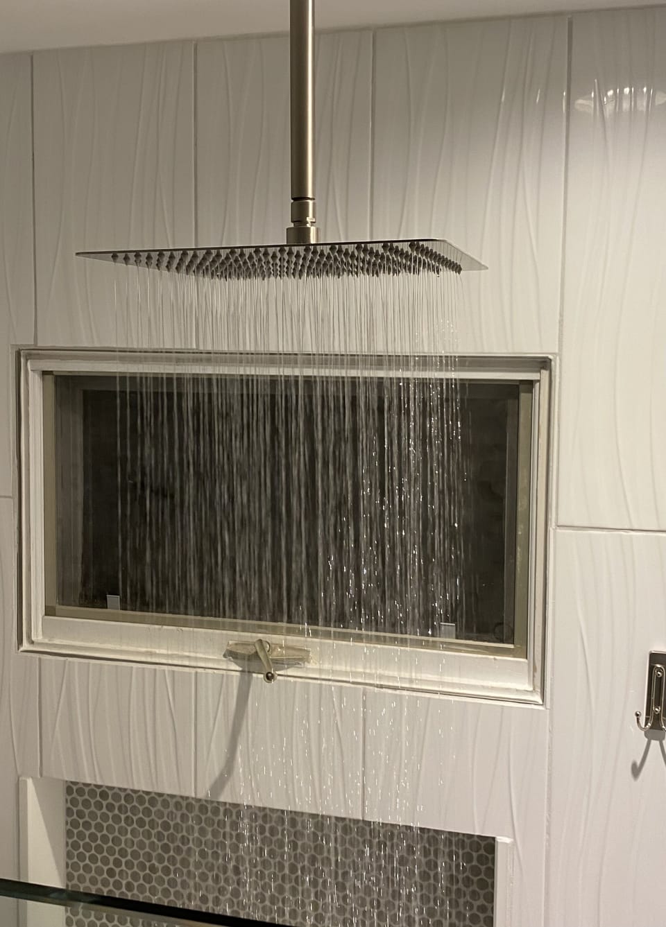 Enjoy the rain showerhead in the masterbath after a long day at the beach