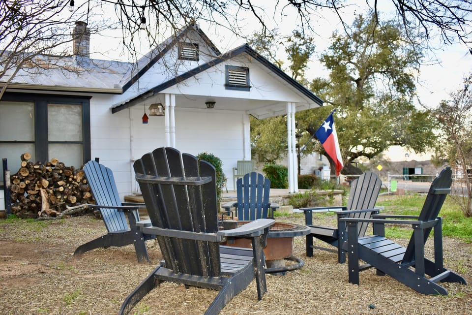 Fire pit for fireside chats sitting in Adirondack chairs + charcoal grills
