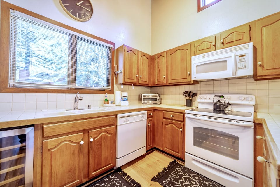 Kitchen has all standard appliances and a wine fridge.