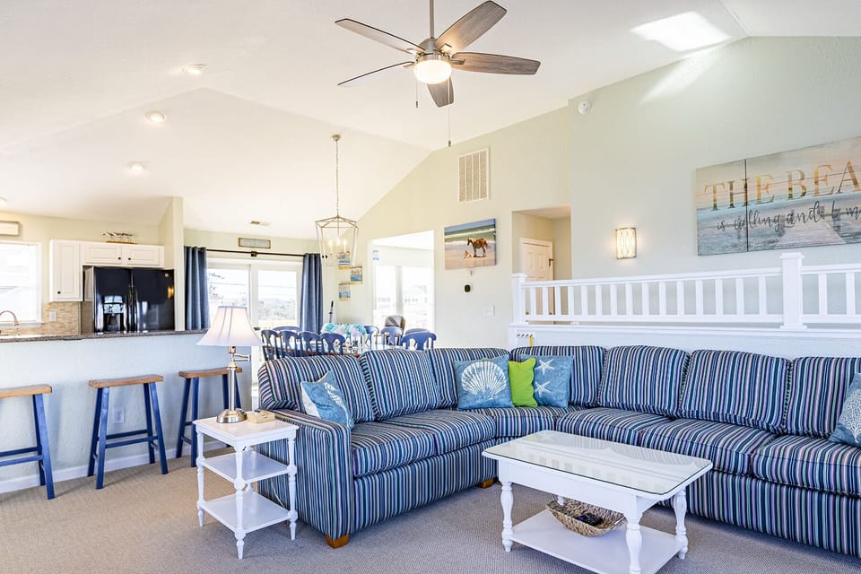 Living Room - Thoughtfully designed with the ocean in mind, this sea of blues provides a relaxing and inviting living space.