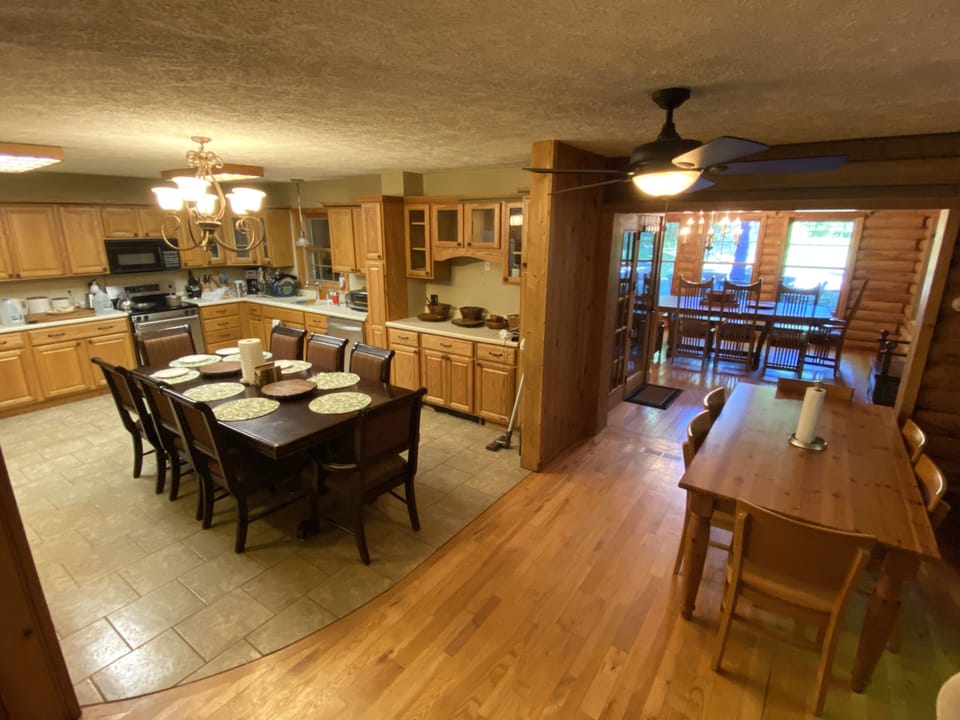 Kitchen with (2) tables, seating up to (14) people 