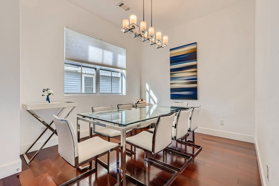 This spacious dining area can seat 8 guests, and is right next to the kitchen