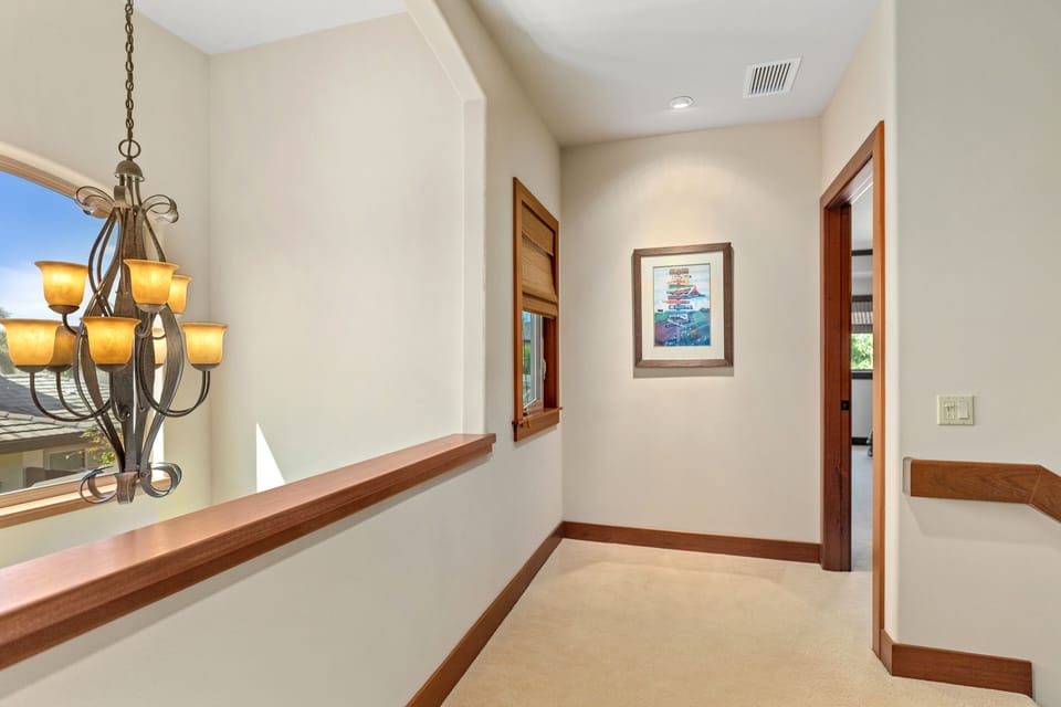 Separated long hallway leads to guest room 