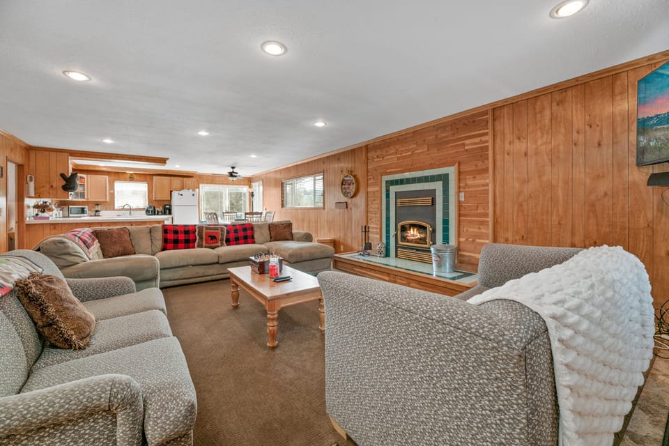 Living Room. - Adorable Living Room with plenty of comfy seating, TV's and a fireplace!