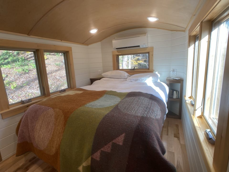 Queen bed in separate bedroom with its own mini-split.