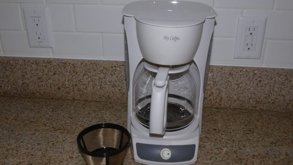 Coffee pot with gold filter.