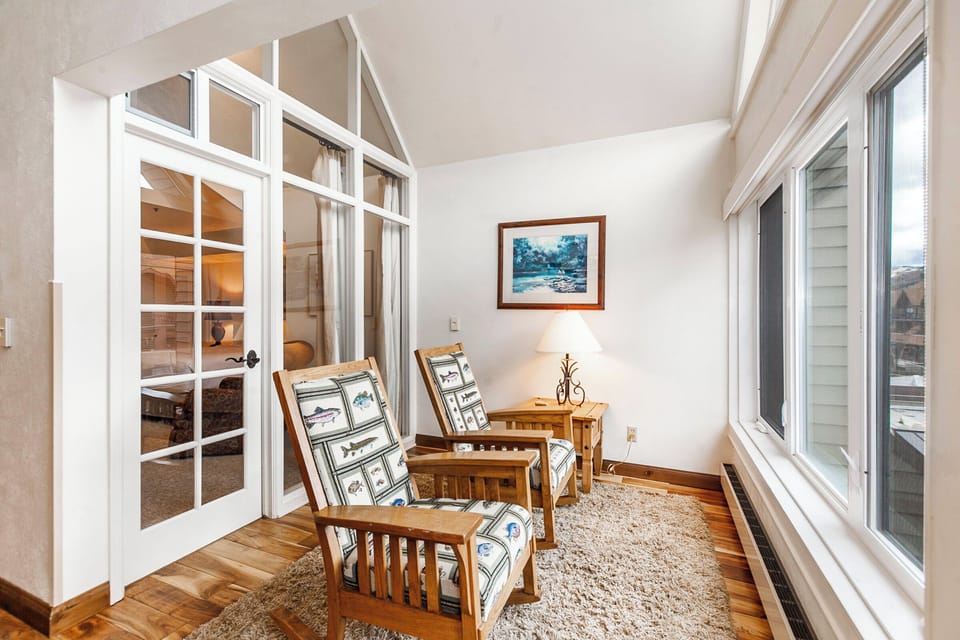 Sunroom / Nook with views of the ice skating rink.
