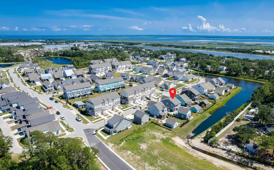 Aerial showing pond behind home, Taylors creek and the Bogue Sound in background