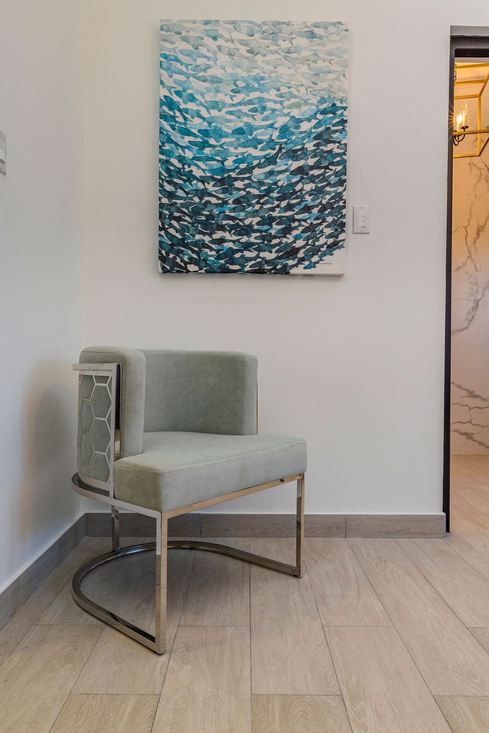 You will find a canvas painting of the Sardines Run in the corner.