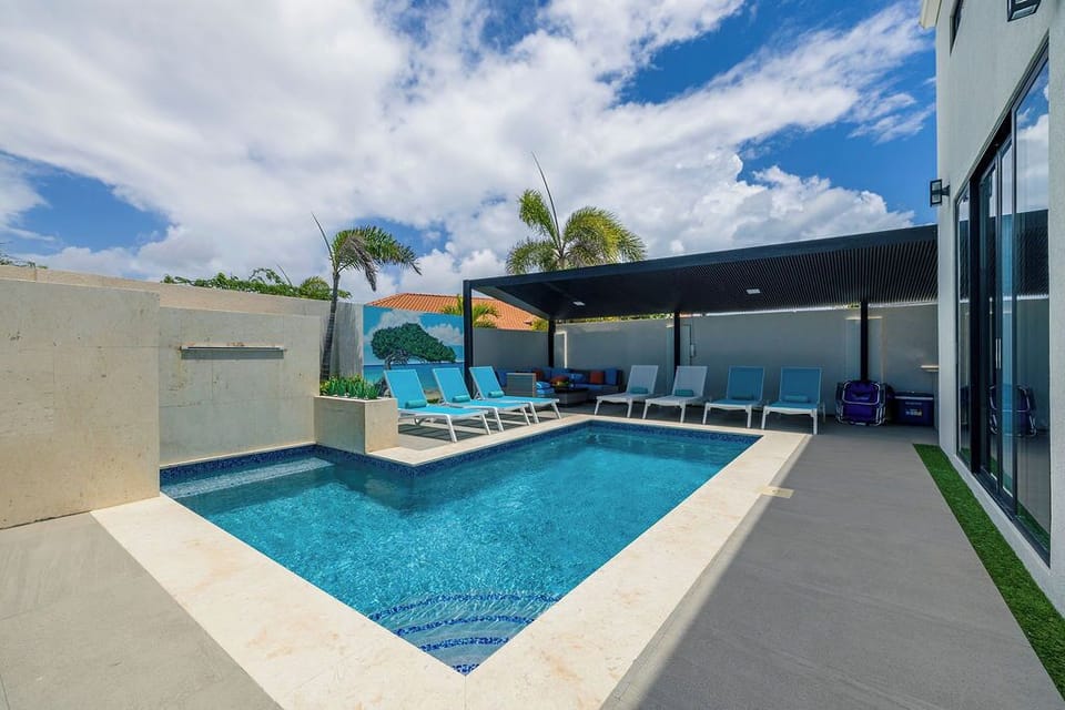Dive into relaxation and enjoy the sparkling pool, perfect for a refreshing dip or lounging the day away.