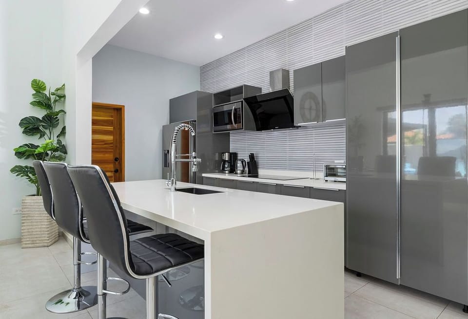 Enjoy the convenience of a full kitchen with a spacious island counter and seating for three — perfect for cooking, dining, or gathering with loved ones.