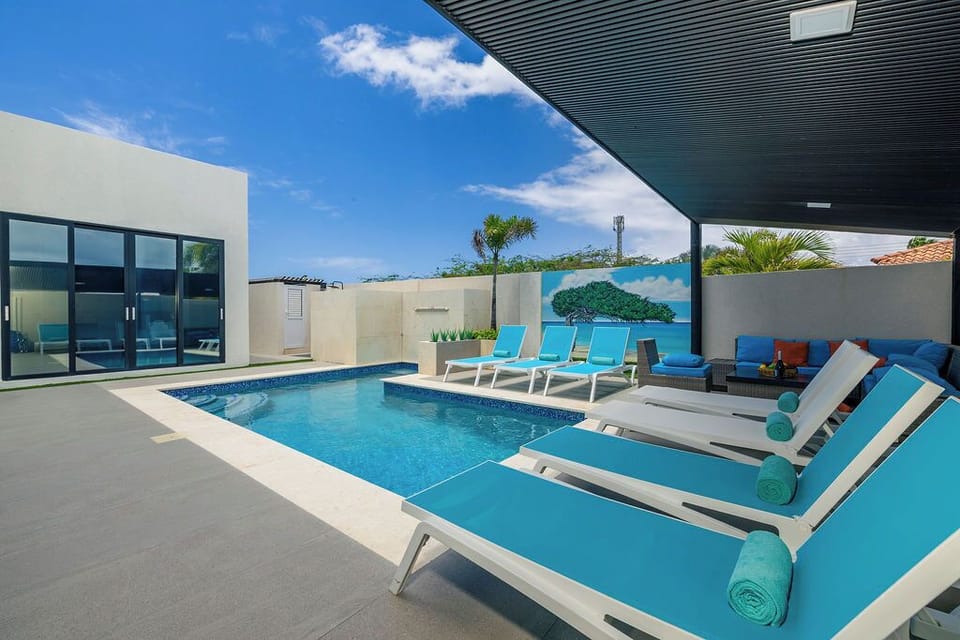 Soak up the sun in style by the pool, complete with comfy lounge chairs for the ultimate in relaxation and laid-back vibes.