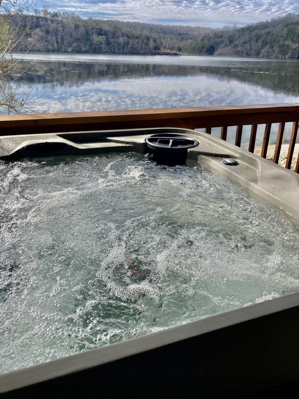 Enjoy your private hot tub surrounded by the lake and trees!
