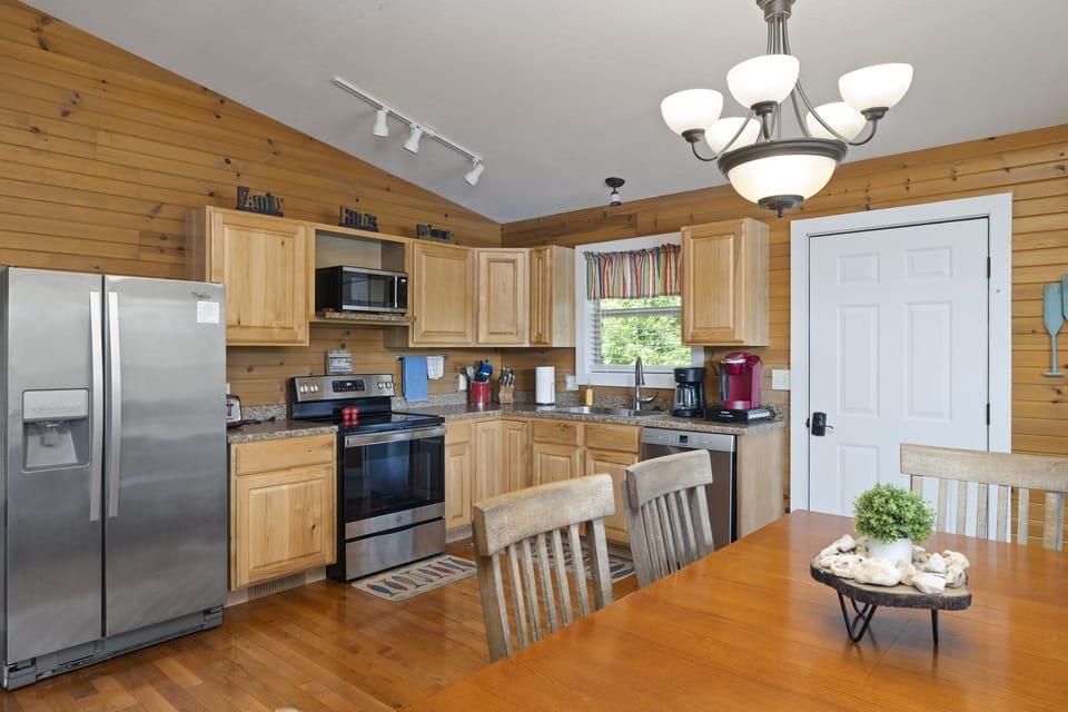 Fully equipped kitchen with stainless steel appliances. 