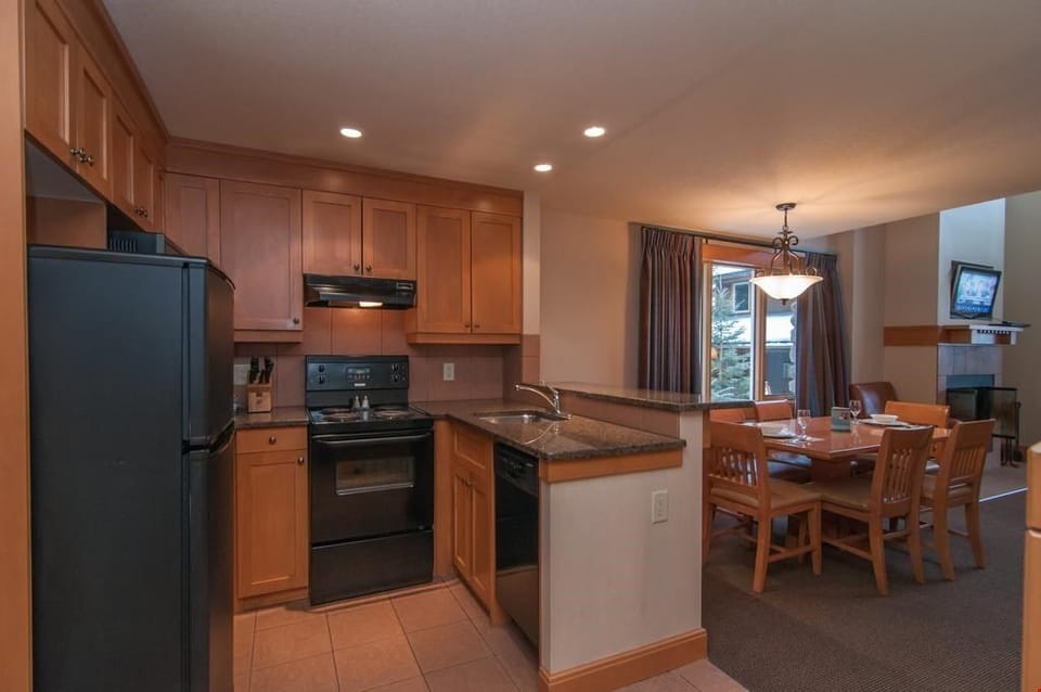 The open-plan kitchen and dining area feature modern amenities.
