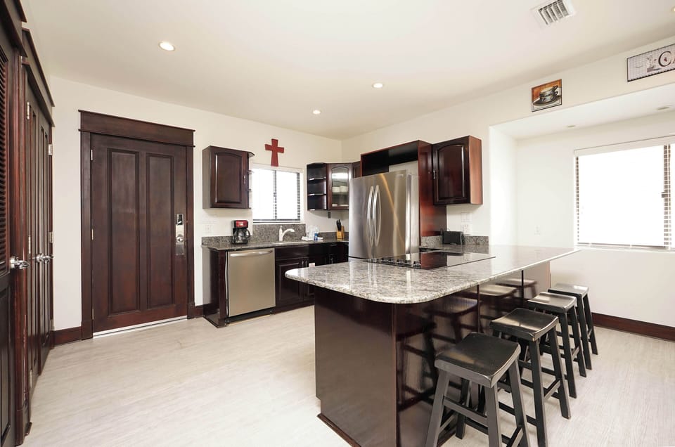 Your gourmet kitchen awaits with granite counters, stainless appliances, and breakfast bar seating for casual dining or morning coffee.