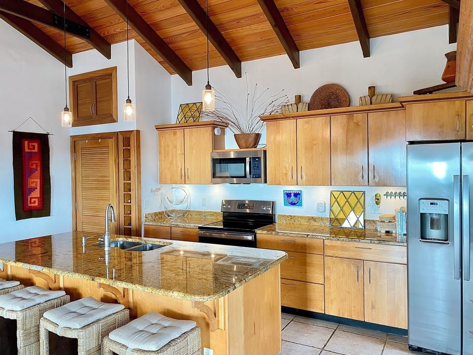 Well stocked kitchen with stainless appliances