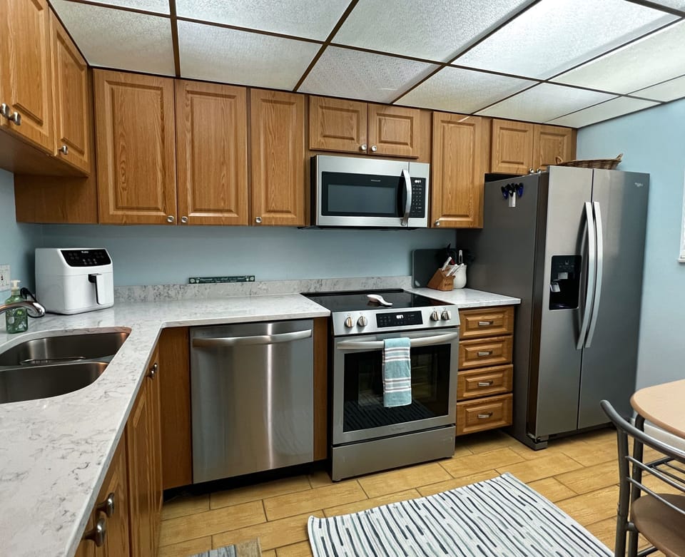 Fully equipped and updated kitchen featuring new appliances. Coo - Fully equipped and updated kitchen featuring new appliances. Cook up your favorite meals and snacks while here on vacation!