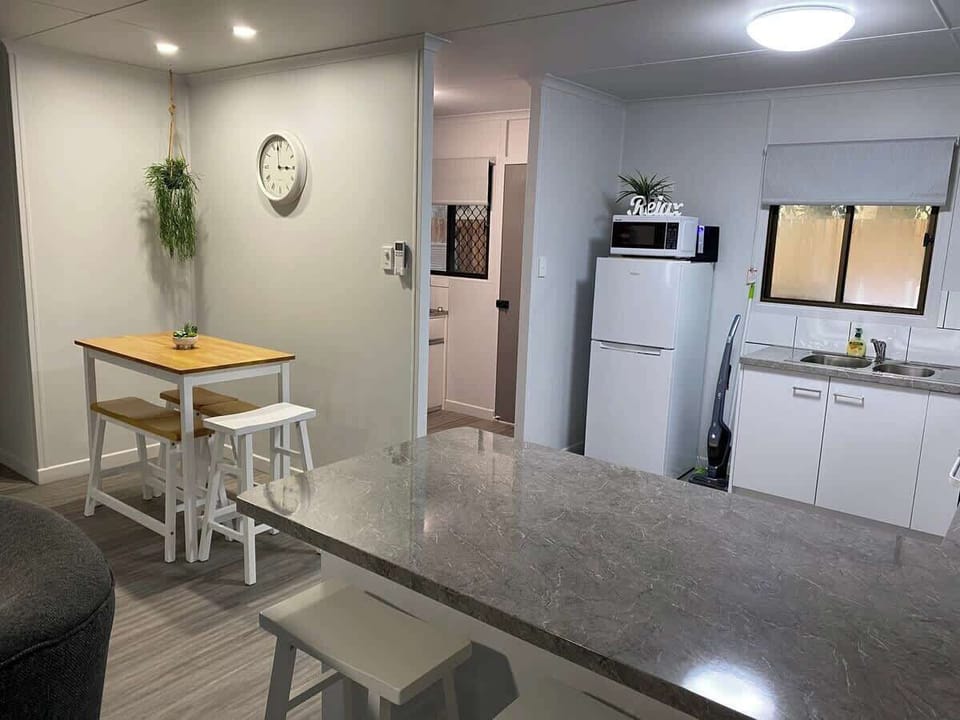Plenty of seating both at the breakfast bar and the dining table which can also double as a workspace if you need it.