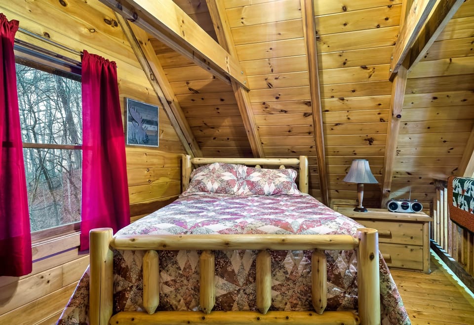 Loft bedroom area with queen-size bed