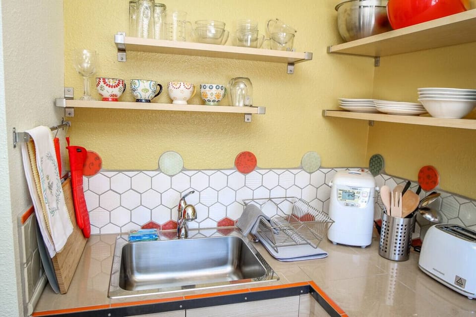 Stylish cups and cookware compliment this historic kitchen
