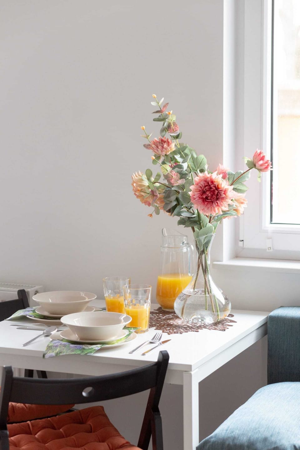 Dining table with tableware.